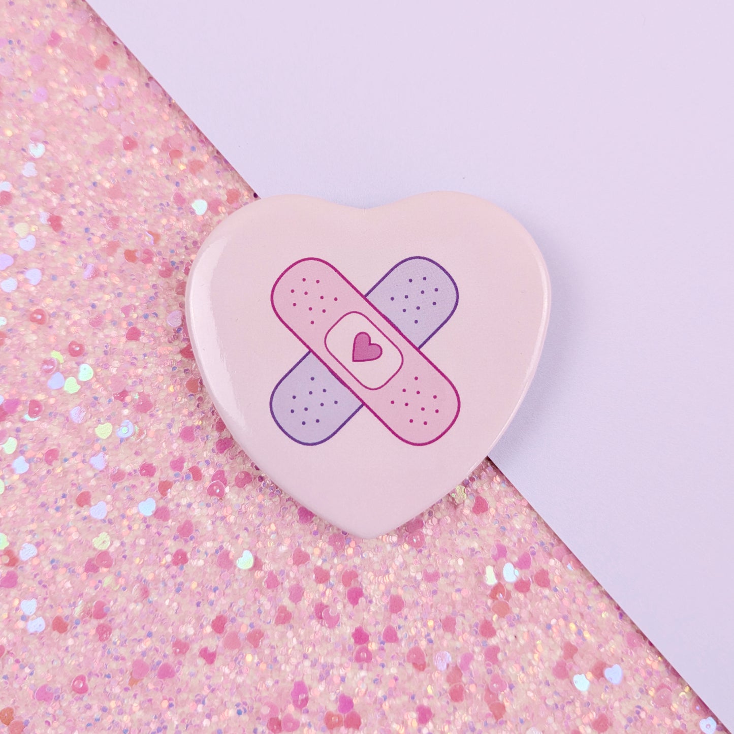 Crossed Bandages Heart Button Badge