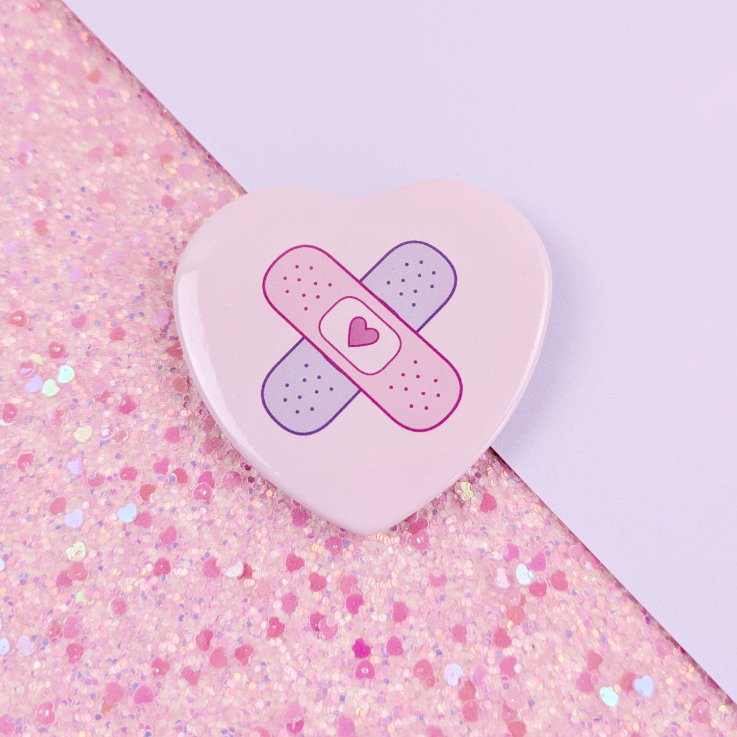 Crossed Bandages Heart Button Badge