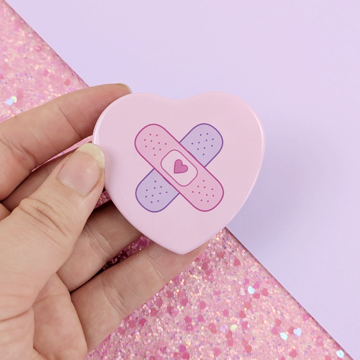Crossed Bandages Heart Button Badge